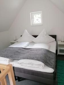 Postel nebo postele na pokoji v ubytování Harz-Tiny