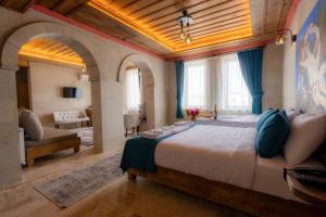 Ένα ή περισσότερα κρεβάτια σε δωμάτιο στο Rio Cappadocia Hotel