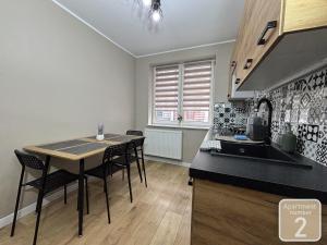 Kuchyňa alebo kuchynka v ubytovaní Apartamenty Przy Deptaku w Radomiu + 9 fotografií