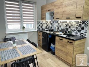 Kuchyňa alebo kuchynka v ubytovaní Apartamenty Przy Deptaku w Radomiu