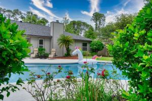 a swimming pool with a white swan in a yard at Private Heated Pool Arcade Games Sleeps 10 Jacksonville Home in Jacksonville