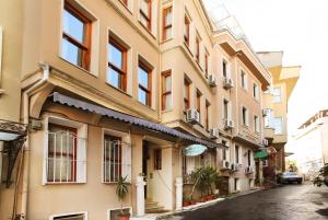a building on a street in a city at Theodian Hotel in Istanbul