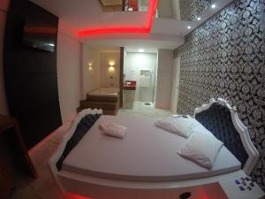 Postel nebo postele na pokoji v ubytování Motel Glamour