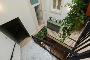 an overhead view of a stairway with plants at xenia apartments & suite in Syracuse