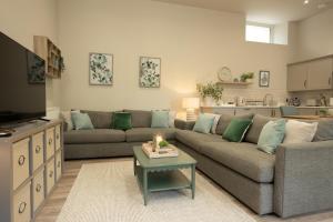 a living room with a couch and a table at Sidey Court in Berwick-Upon-Tweed +54 photos