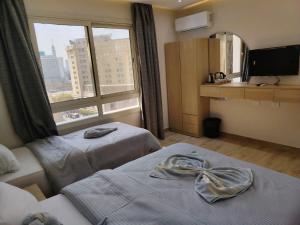 Letto o letti in una camera di Landmark Hostel Cairo