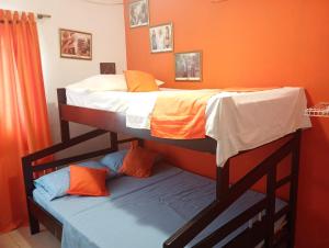 Postel nebo postele na pokoji v ubytování Hotel Taganga Dive Santa Marta