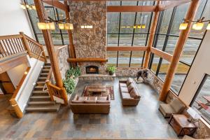 an overhead view of a living room with a fireplace at Breeze Inn Hotel in Seward +102 photos