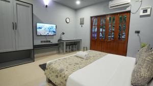 Televisor o centre d'entreteniment de Sort By Stays , Siolim