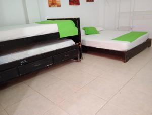 Postel nebo postele na pokoji v ubytování Hotel Taganga Dive Santa Marta