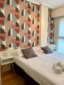 Posteľ alebo postele v izbe v ubytovaní Xuloss Apartments 1