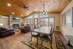 a dining room and living room with a table and chairs at On Beech Time in Beech Mountain