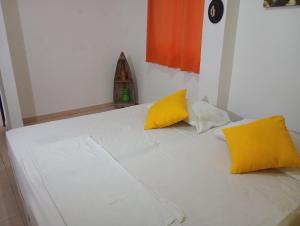 Postel nebo postele na pokoji v ubytování Hotel Taganga Dive Santa Marta