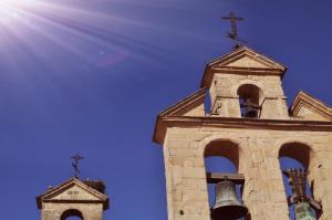 a church steeple with two crosses and a bell at Plaza Plateros in Jerez de la Frontera