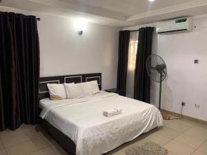 Katil atau katil-katil dalam bilik di House 26 Apartment and Suites