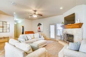 a living room with two couches and a fireplace at 7 Mi to Dtwn Family Home with Patio in Lubbock in Lubbock
