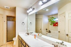 a bathroom with a sink and a large mirror at 7 Mi to Dtwn Family Home with Patio in Lubbock in Lubbock +16 photos