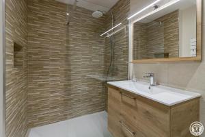 a bathroom with a sink and a shower at La maisoun d'odette in Mérenvielle +28 photos