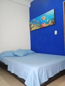 Postel nebo postele na pokoji v ubytování Hotel Taganga Dive Santa Marta