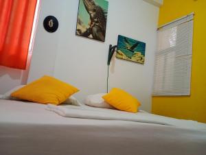 Postel nebo postele na pokoji v ubytování Hotel Taganga Dive Santa Marta