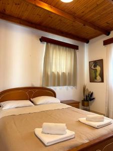 a bedroom with a bed with two towels on it at Levante Apartment for 4 in Faliraki +30 photos