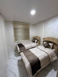 Postel nebo postele na pokoji v ubytování Appartement internationale