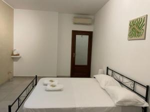Postel nebo postele na pokoji v ubytování Fiordalisi home