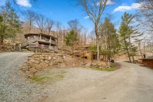 a house on the side of a dirt road at Round House in Beech Mountain