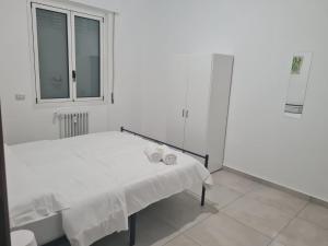 Postel nebo postele na pokoji v ubytování Fiordalisi home