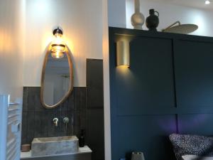 a bathroom with a sink and a mirror at Chambre Cosy Chic in Challans +59 photos