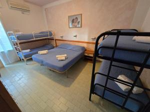 Postel nebo postele na pokoji v ubytování Hotel Rosa