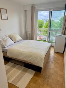 Postel nebo postele na pokoji v ubytování Manuela Home