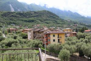 a town in a valley with mountains in the background at The green house in Malcesine +14 photos