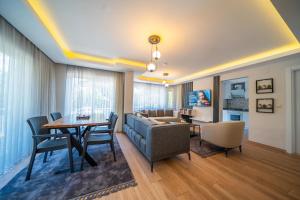 a living room with a couch and a table at Villa Necati Bey in Marmaris