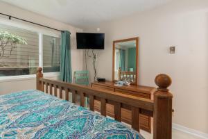 Postel nebo postele na pokoji v ubytování Ocean Terrace Condominiums