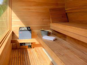 an inside of a sauna with a bucket at Kubla Khan - Chirripó Mountain Riverfront Retreat in Rivas