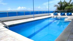 a large swimming pool on the side of a building at Laguito Suites Cartagena in Cartagena de Indias