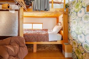 a small bedroom with a bunk bed in a house at Guesthouse & Kitchen Hace - Vacation STAY 75344v in Iwaki +17 photos