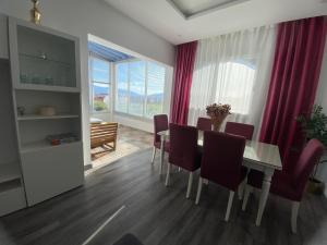 a dining room with a table and chairs and a window at Cabo Beach Home 1 in Cabo Negro