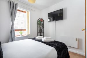 TV a/nebo společenská místnost v ubytování Charming Apt Trafalgar Square