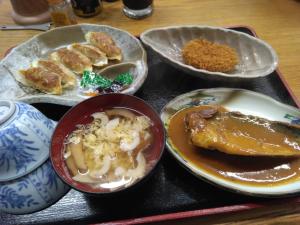 a tray with plates of food on a table at Ogawaya Ryokan - Vacation STAY 87447v in Tahara +5 photos
