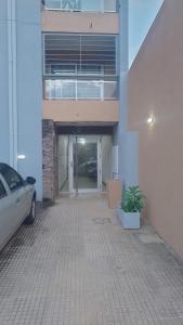 a car parked in front of a building at Franco l in Posadas
