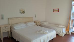 Voodi või voodid majutusasutuse Hotel Il Cipresso toas