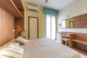 Postel nebo postele na pokoji v ubytování Hotel Bamby e Delfino