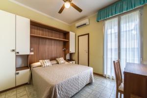 Postel nebo postele na pokoji v ubytování Hotel Bamby e Delfino