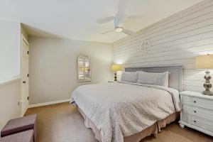 a bedroom with a bed and a white wall at Jarvis #301 in Durango