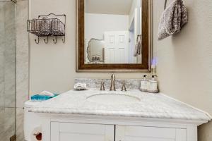a bathroom with a white sink and a mirror at Jarvis #301 in Durango +29 photos