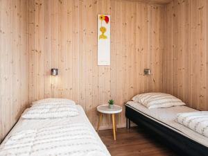 Postel nebo postele na pokoji v ubytování 16 person holiday home in Løkken-By Traum