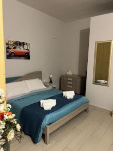 Ένα ή περισσότερα κρεβάτια σε δωμάτιο στο Il Sorriso