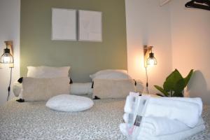 a living room with two chairs and two lights at Home lysea Major in Marseille